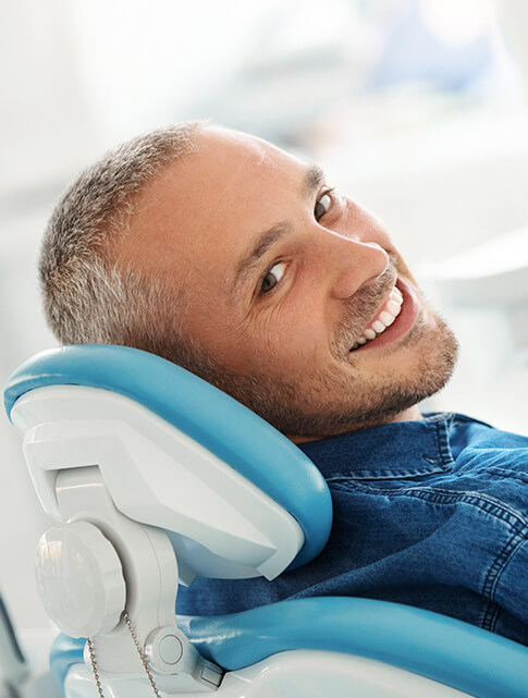 smiling man at the dentist