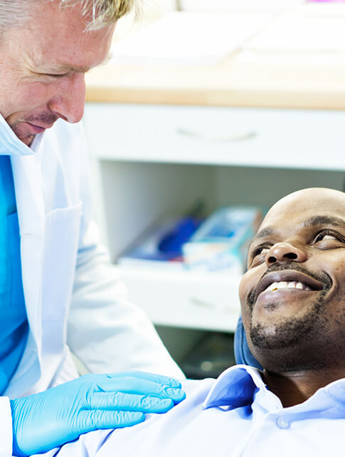 dentist comforting a patient