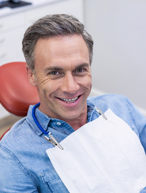 smiling man at the dentist