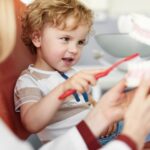child dental visits, child in dental chair