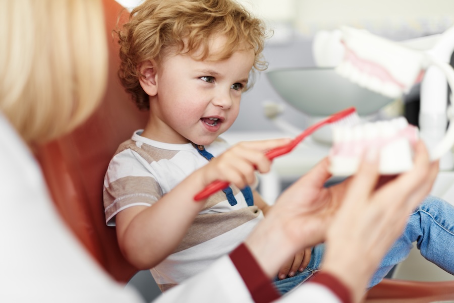 child dental visits, child in dental chair