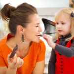 woman eating halloween candy, halloween candy break tooth, damage teeth